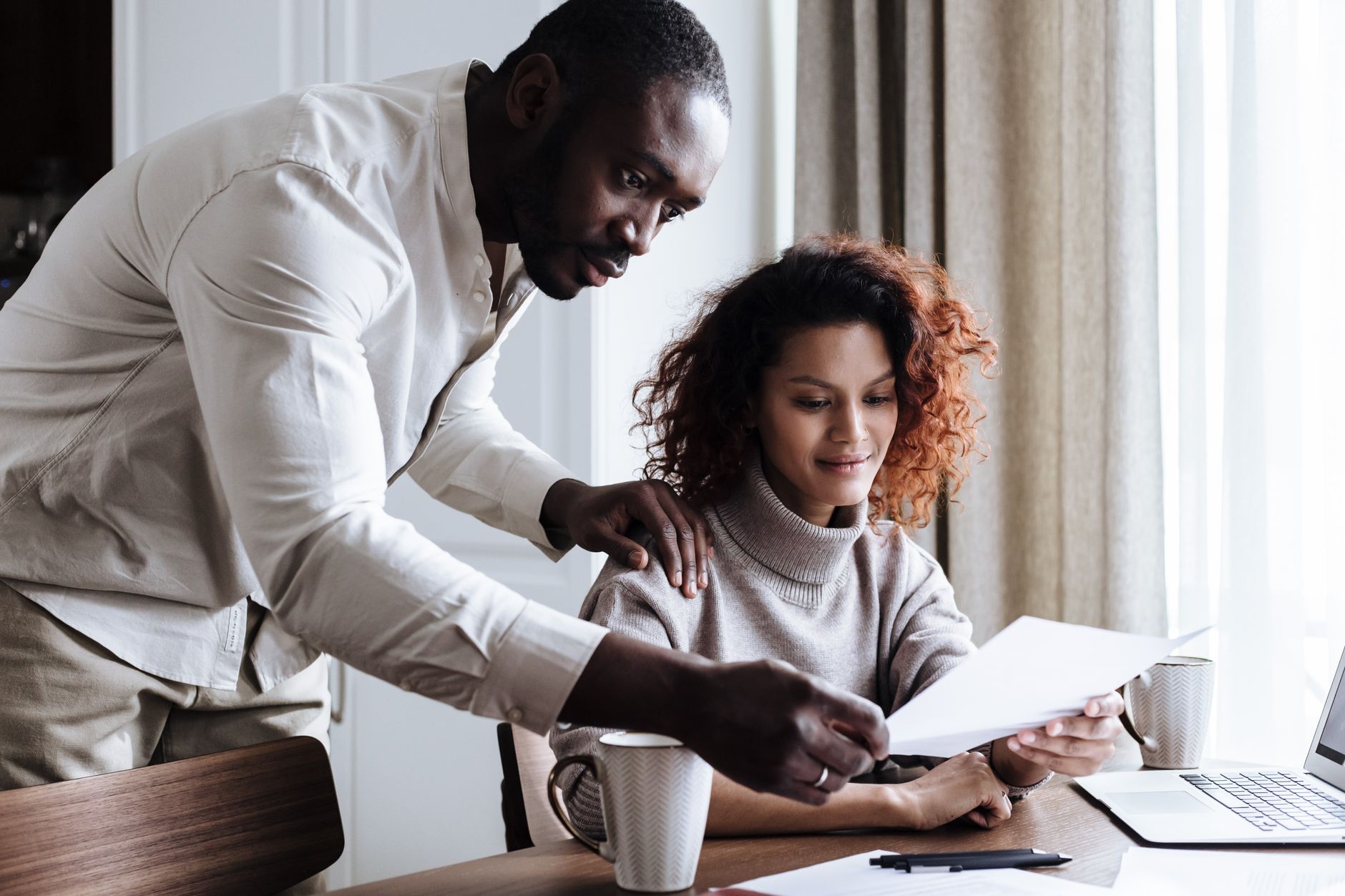 Couple reviewing financing documents for a home improvement project