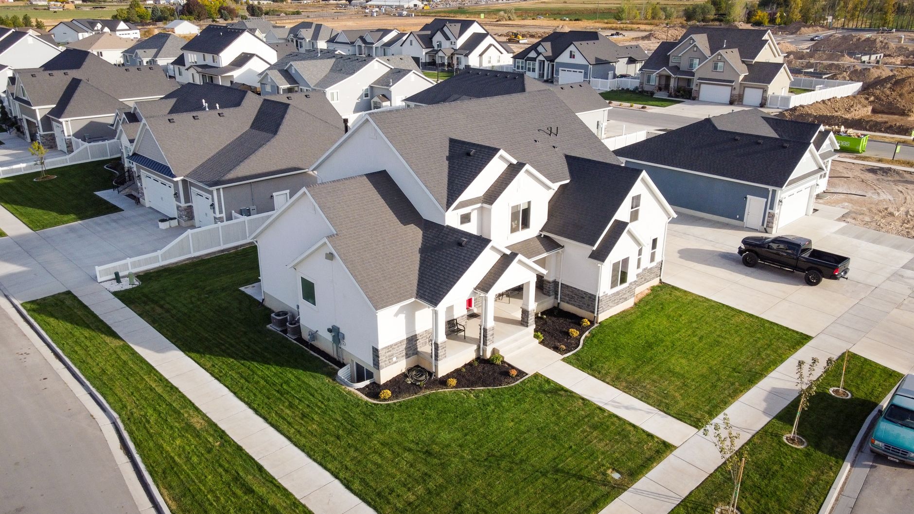 Aerial view of a planned suburban community with uniform homes